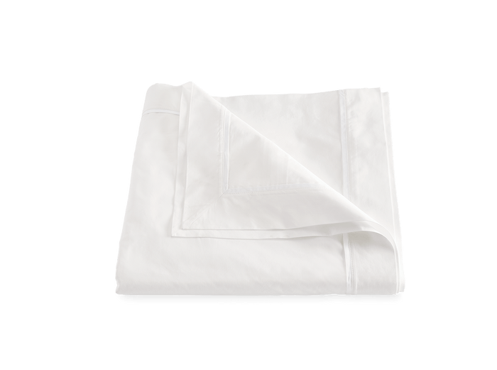 Matouk Gatsby percale bedding in bone white.